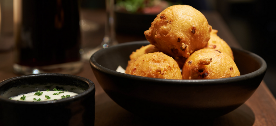 Applewood smoked bacon beignets with creme fraiche at Frances