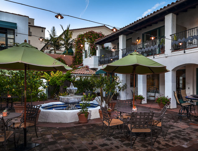 A lush garden courtyard lies at the center of the Spanish Garden Inn