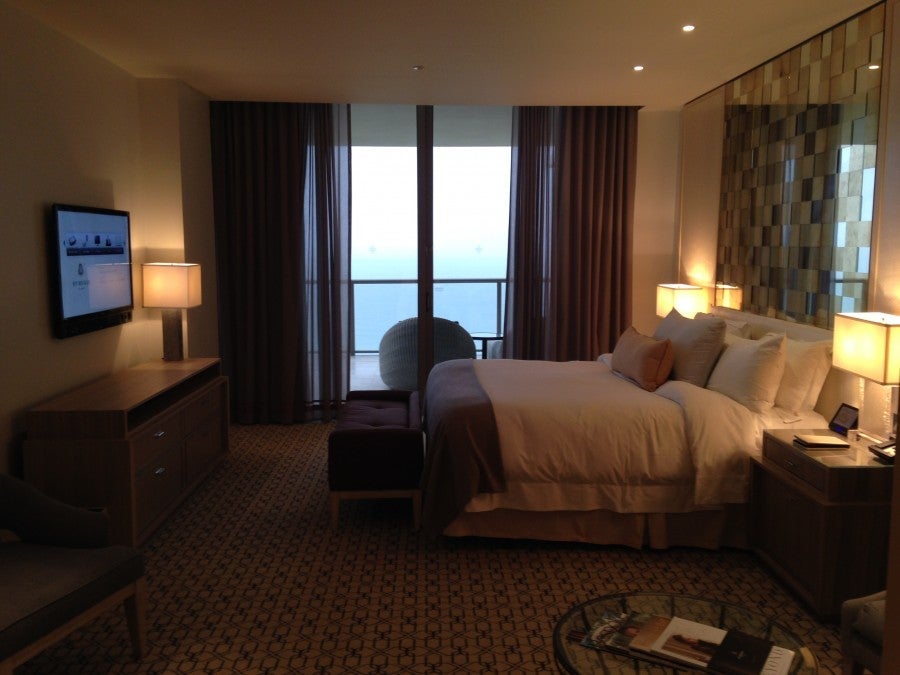 The floor-to-ceiling sliding doors (leading to a spacious balcony) made the bedroom feel even larger than it was.