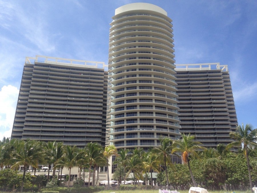 The exterior of the hotel, viewed from the beach.