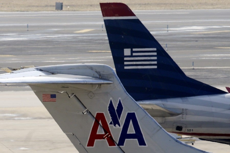 You can officially get US Airways miles by flying American.