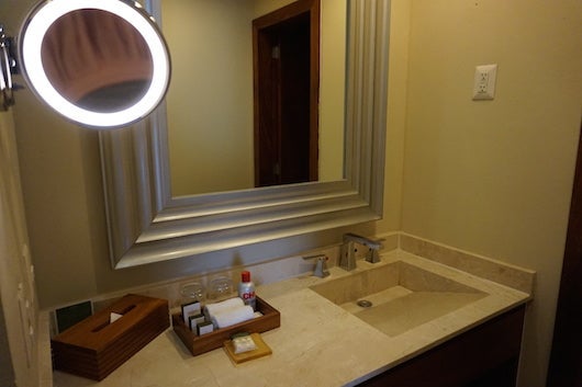 The spacious marble bathroom vanity. Note the CHI products.