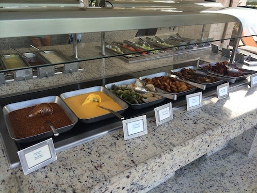 The unappetizing nacho cheese and chili on the other side of the poolside buffet