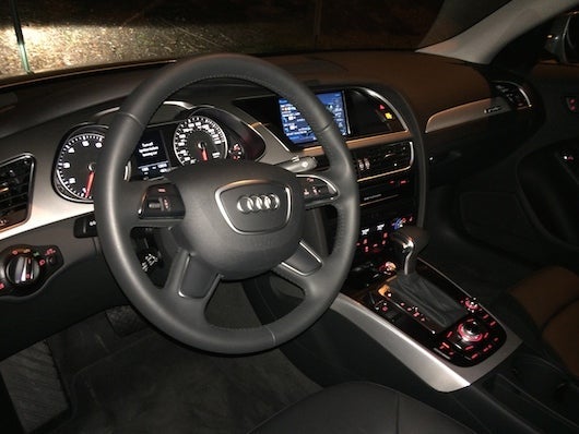 The car's steering wheel, control panels and interior.