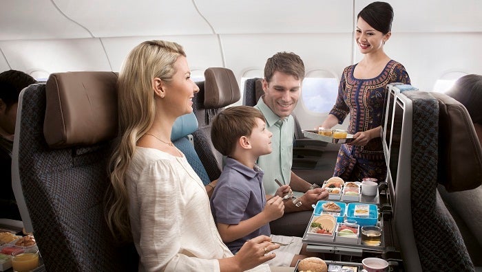 When you travel in coach on Singapore, you still enjoy the service of the world-renowned Singapore Girl