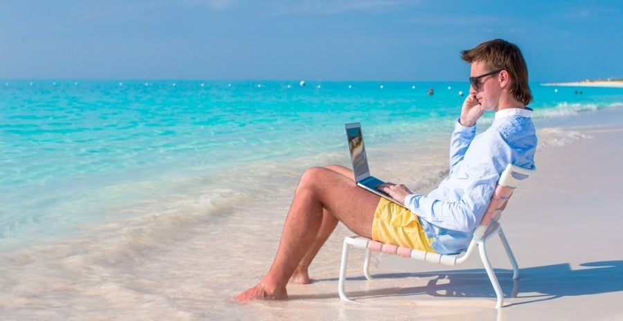 You may not want to stay connected when visiting a secluded beach, but many carriers allow it! Image courtesy of Shutterstock.