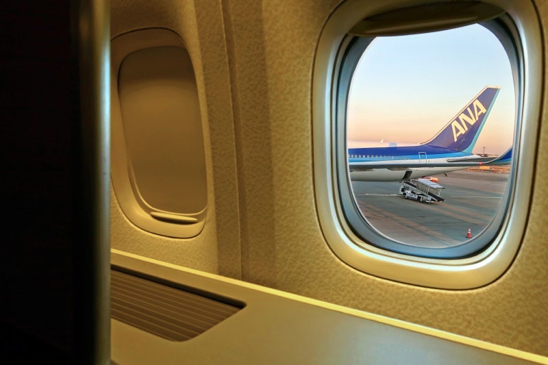 ANA's 777-300ER first class is arranged in a 1-2-1 configuration, so each of the window seats also has aisle access.