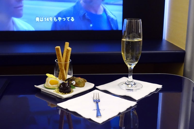 I started with a trio of appetizers and a glass of Krug Champagne.