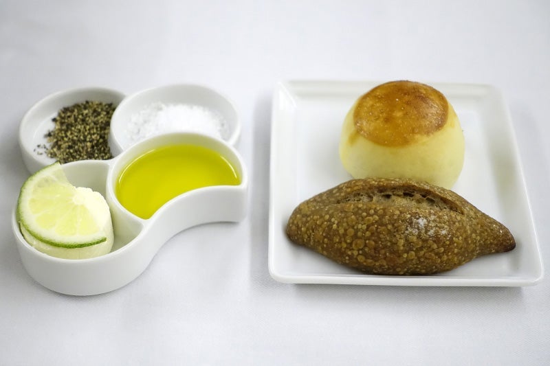 Bread with salt and pepper, olive oil and butter in ANA first class.