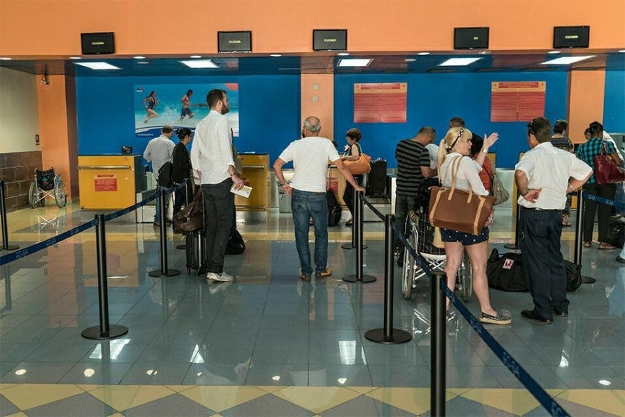 At long last, I grew closer to the front of the charter-flights check-in line at HAV