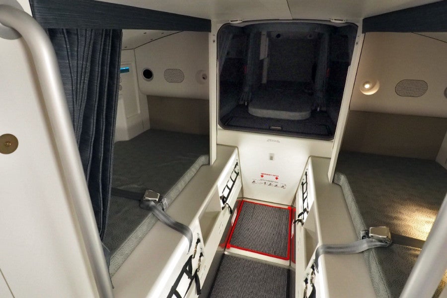 The Qatar A350 crew rest area is quite large, with one bed in the front above the entrance, two in the middle and three in the rear.