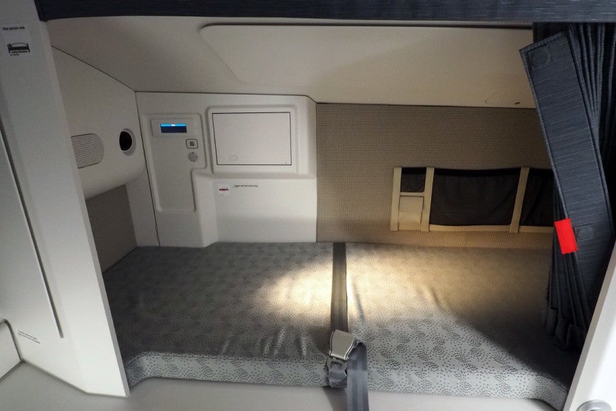 On Qatar's Airbus A350, flight attendants have real (albeit thin) mattresses to sleep on.