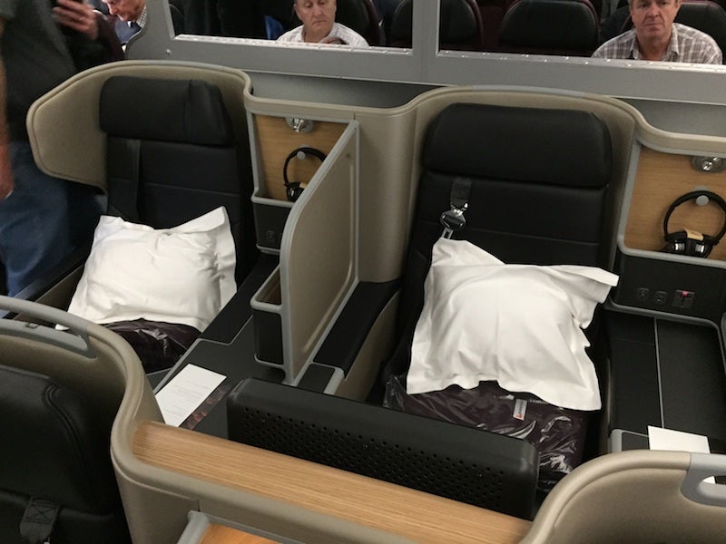 Try to avoid the back row of business class - and the glares of economy passengers!