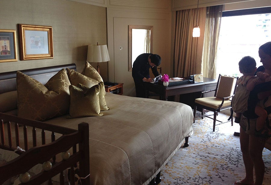 Our Superior room, with a hotel associate checking us in.