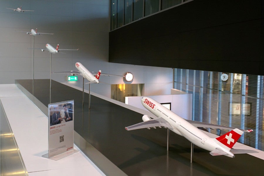 Swiss A330 models on display at the Terminal A lounge.