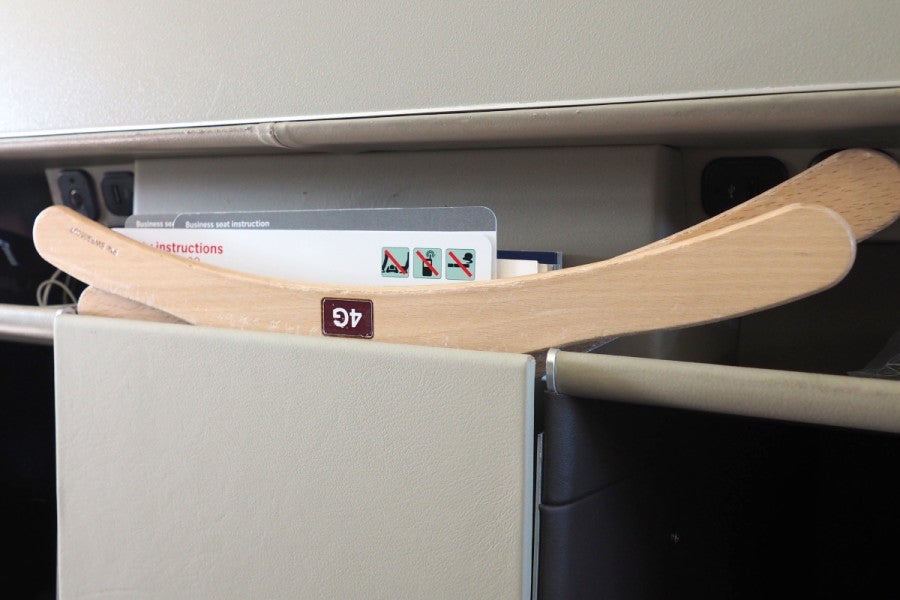 Marked hangers are already at each seat, so flight attendants don't need to make a note when hanging your jacket.