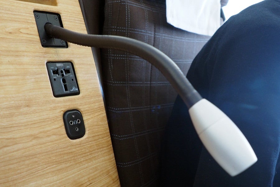 Each seat has a universal power outlet, and a USB jack under the display.