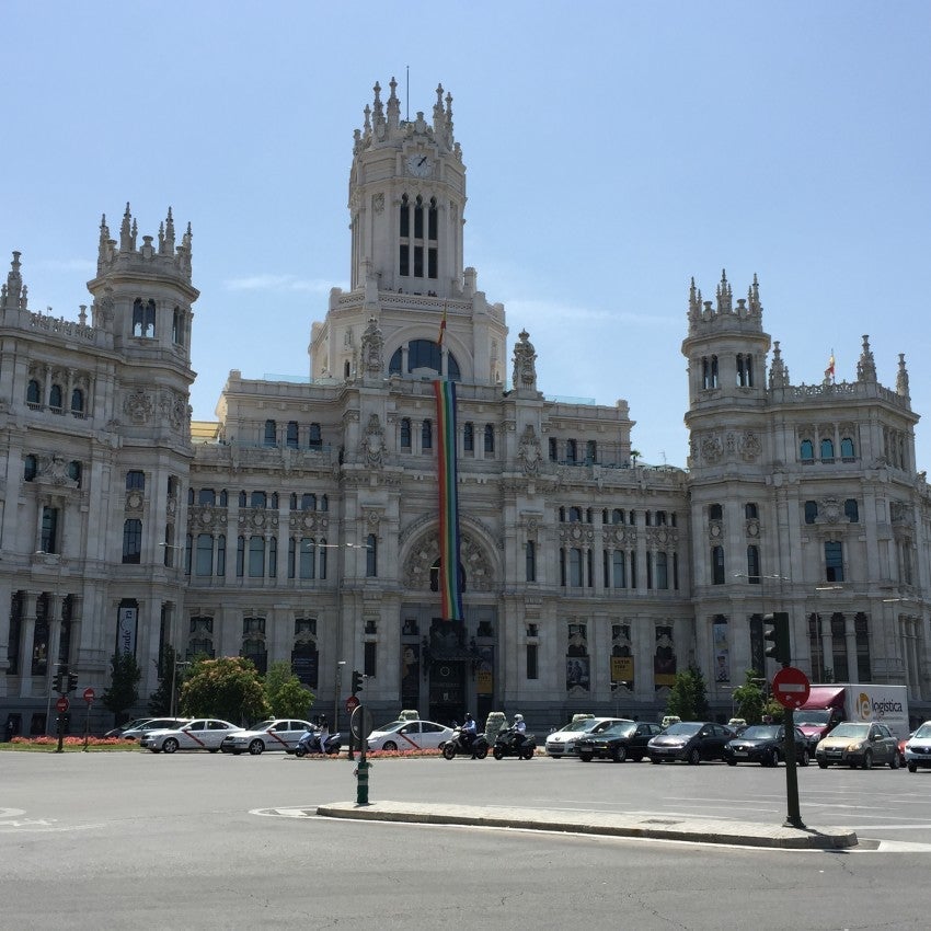The City Hall in Madrid adorned with a giant rainbow banner.