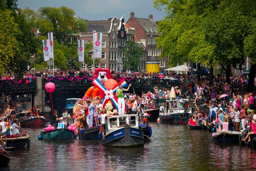 Amsterdam Pride is unique in that the parade takes place on the canals, so definitely pack a bathing suit! Photo courtesy of Shutterstock.