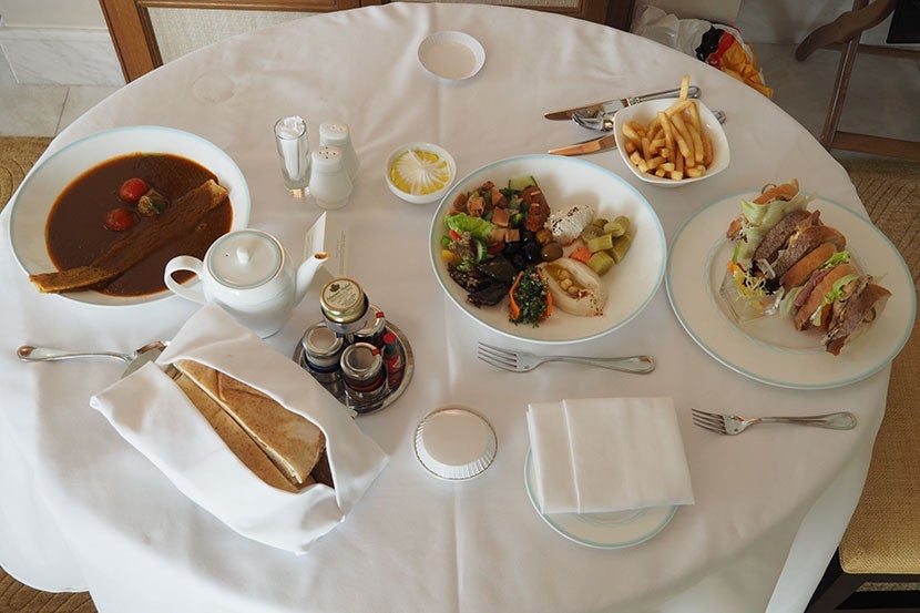 A room-service lunch of tomato soup, mezze and a club sandwich.