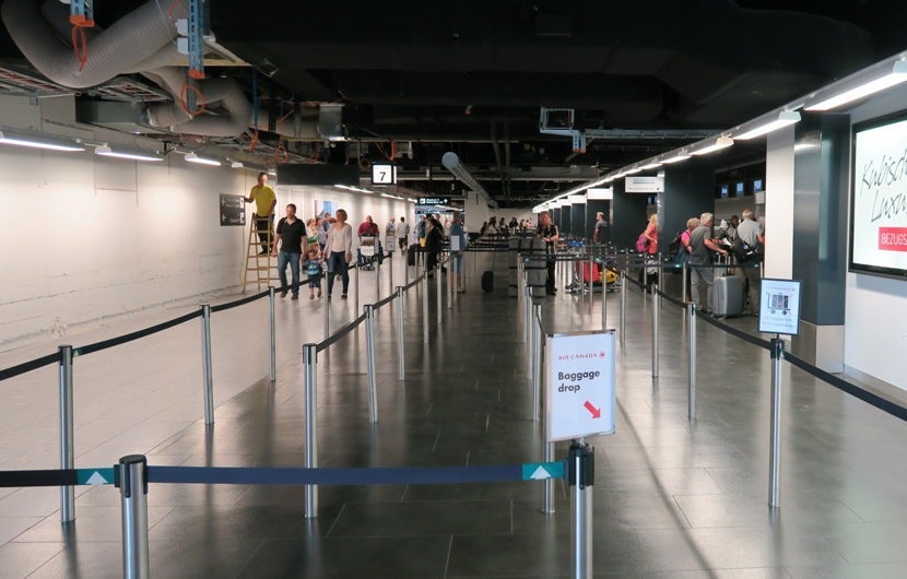 Minimal signage at the Air Canada check-in counter