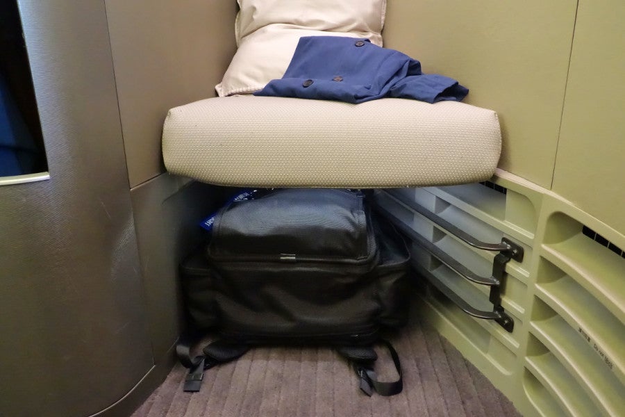 There's space to store a bag below the ottoman.