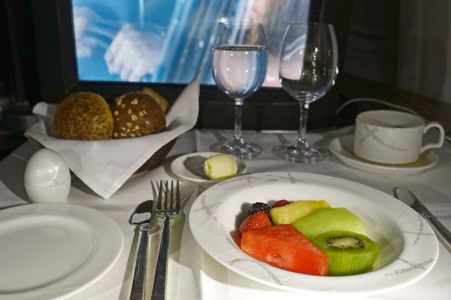 The second meal began with a fruit plate and bread basket.