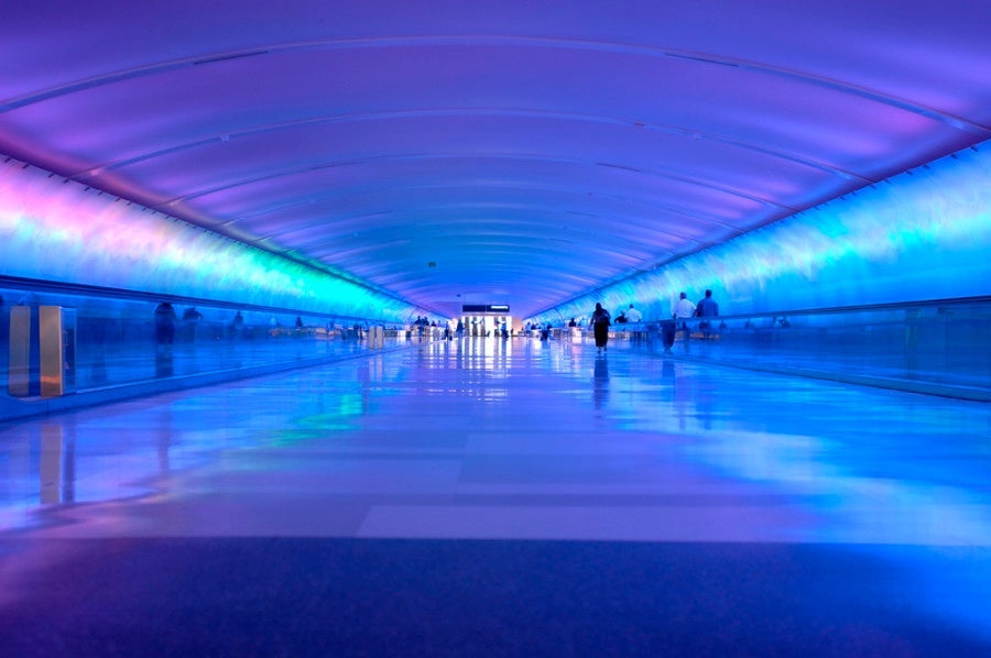 Airport tunnel that glows. Photo courtesy of Shutterstock.