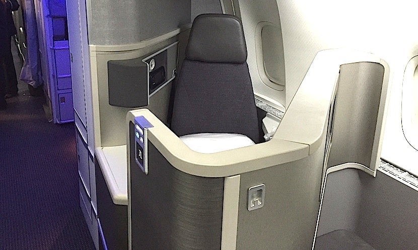 A backward-facing seat at the front of the aft business section.