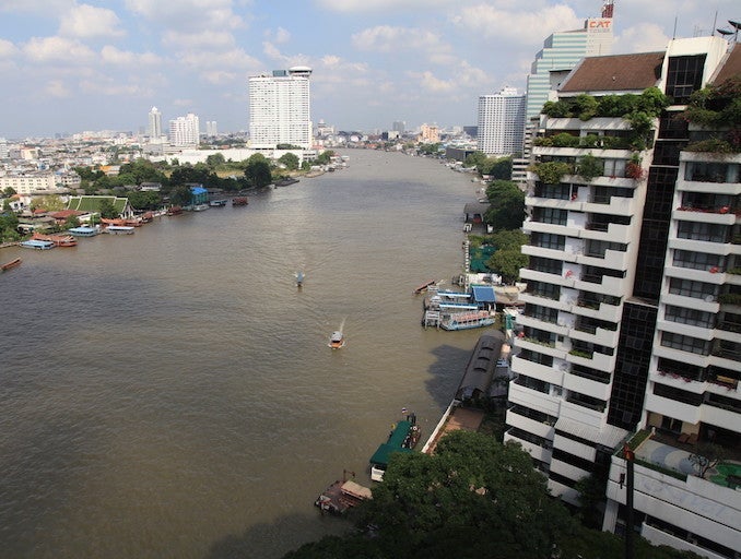 The view from luxury high-rise hotels in Bang Rak, along the Chao Phraya River, make Bangkok look calm and peaceful