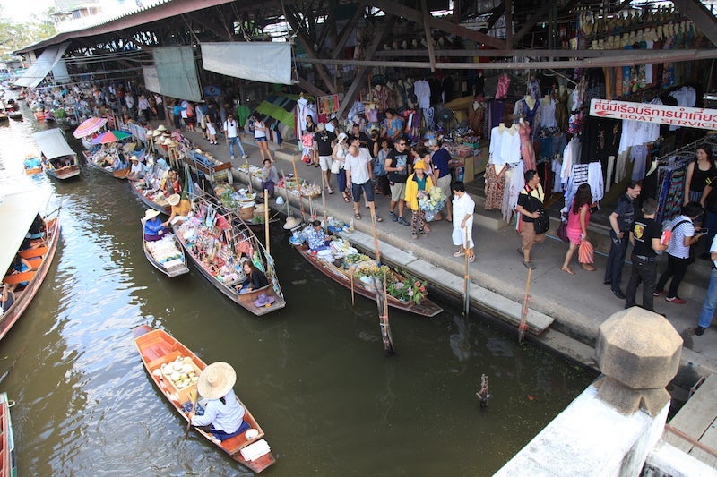 Damnoen Saduak Floating Market attracts locals and a whole lot of tourists -- and it's worth it.