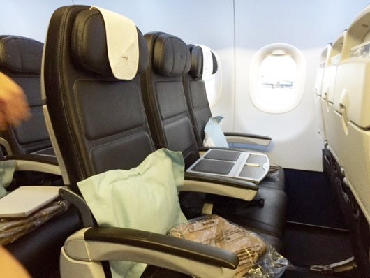 In BA short-haul business class, a tabletop insert blocks the middle seat.
