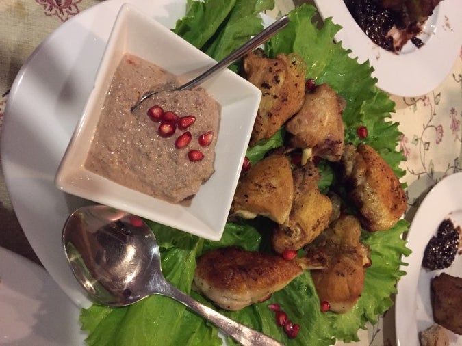 Lightly fried chicken with a walnut and pomegranate sauce.