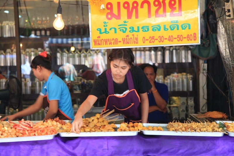 At markets like Chatuchak, push your comfort zone with tasty delights, often served on skewers.