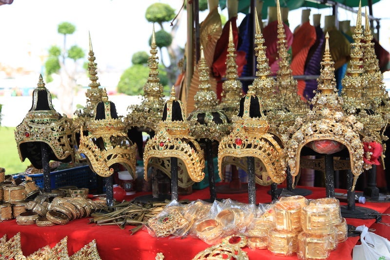 Gilded head dresses and other accoutrements are key to the traditional Thai culture. 