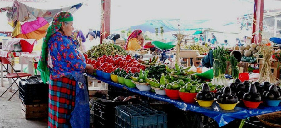 Woman selling produce in Juarez Market in Oaxaca, Mexico. Photo courtesy of Visit Mexico.