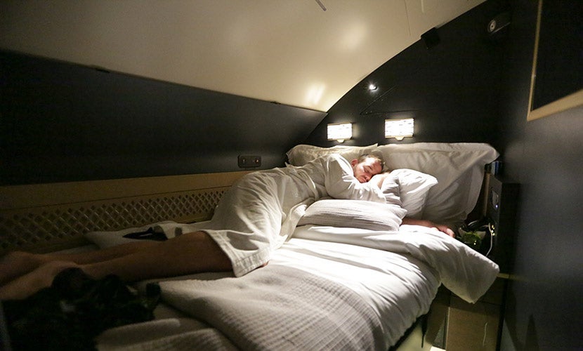The Residence's bedroom has a slanted ceiling.