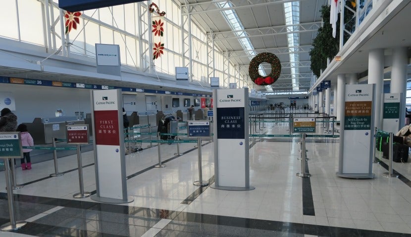 Four different Cathay Pacific check-in lines, each for one class of service.