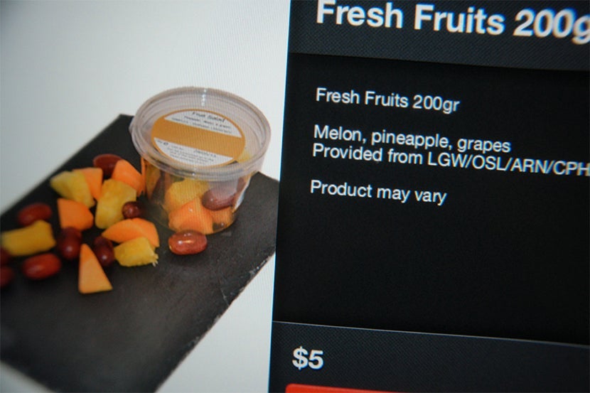 Ordering fresh fruit options via IFE screen.