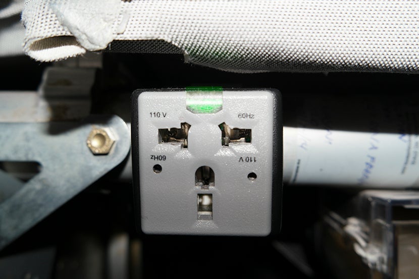 One of the two outlets located beneath every third seat. Image courtesy of Kofi Lee-Berman.
