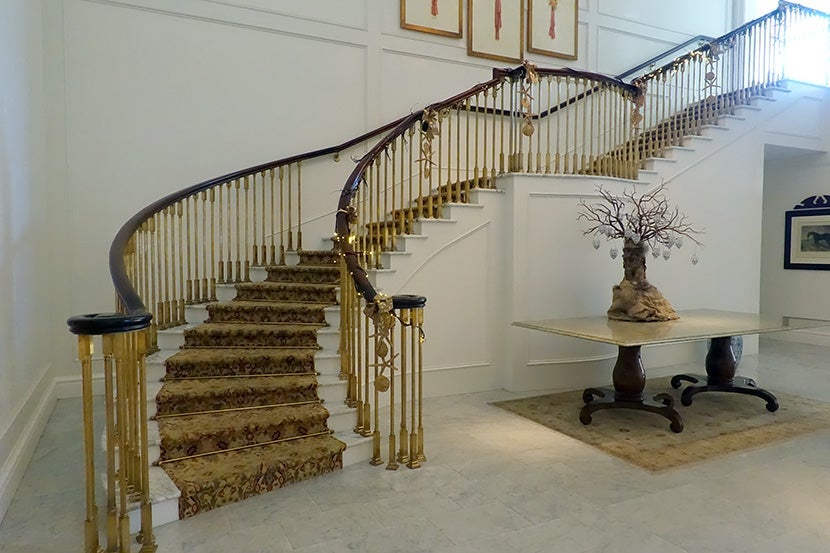 The gorgeous staircase leading up to the rooms — there's also an elevator.