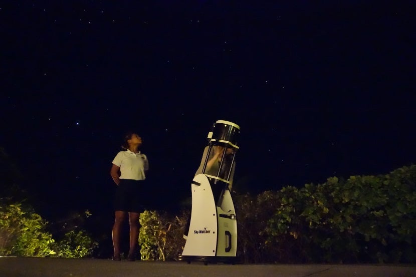 Checking out the night sky through Amanpulo's telescope.