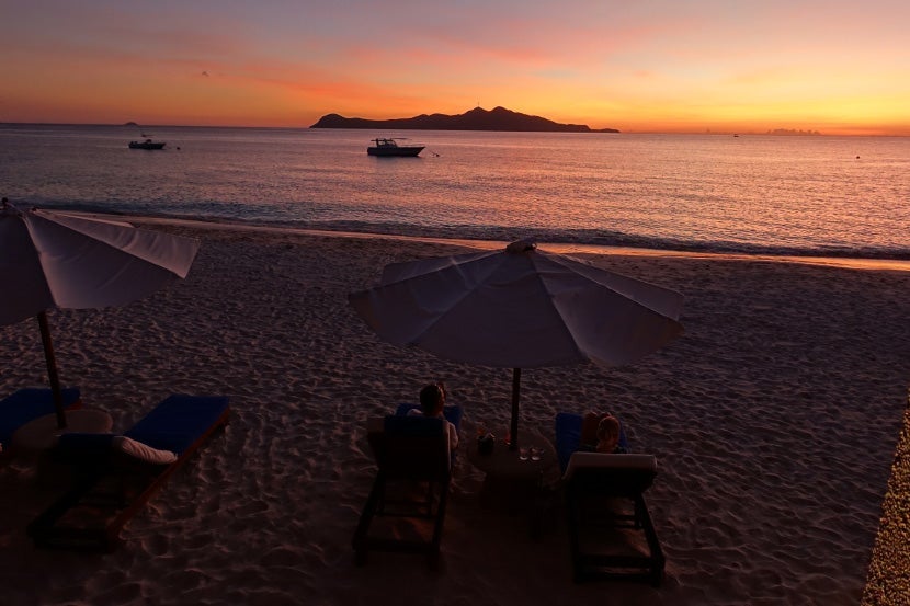 A beautiful sunset, as enjoyed from the beach bar.