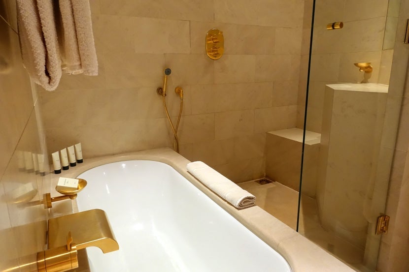 The unique bathtub and shower setup.