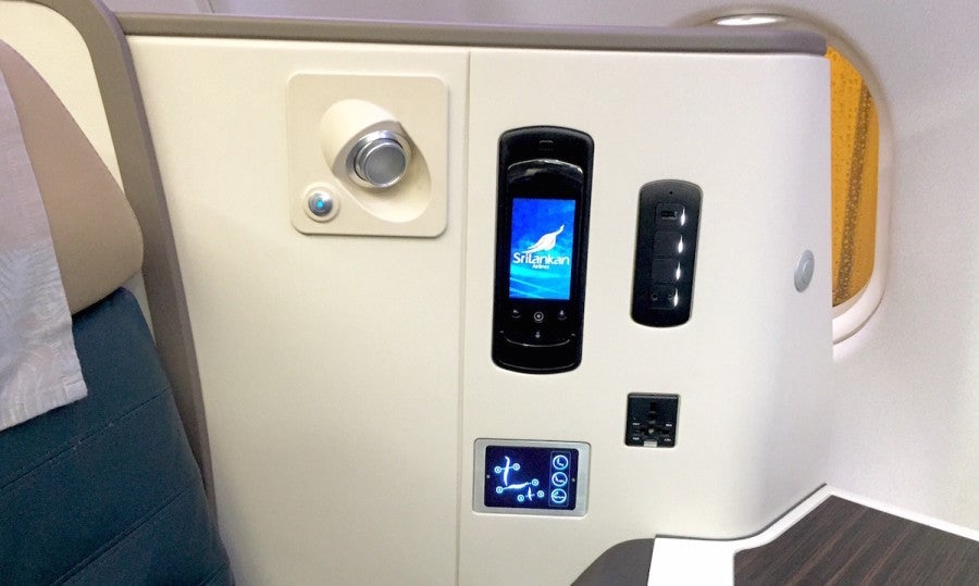 The power ports, seat controls and IFE handheld touchscreen control.
