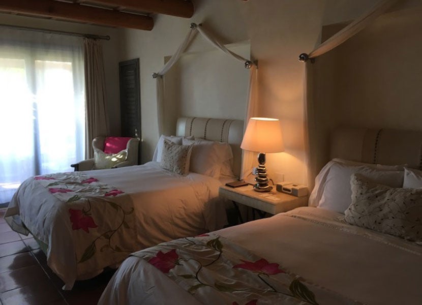 The cozy beds in our deluxe suite at the St. Regis Punta Mita.