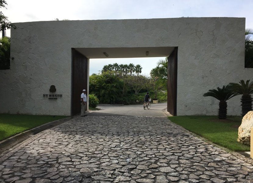 The cobblestone driveway and gate leading to the resort.