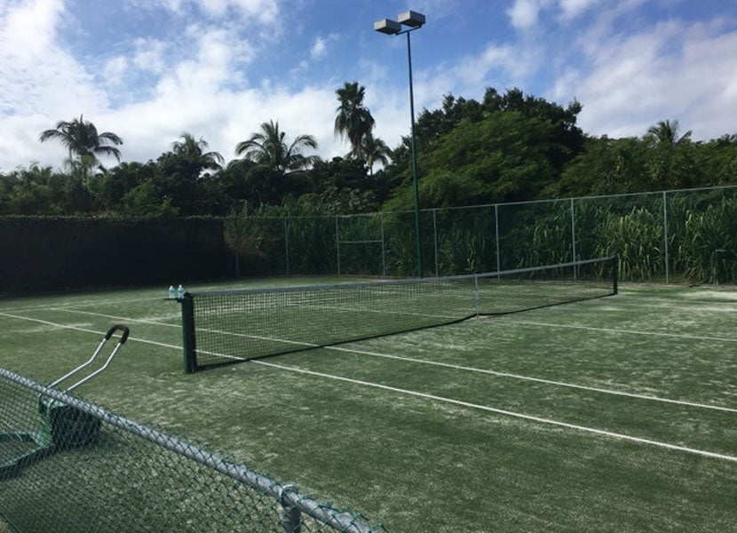 The St. Regis has both grass and hard tennis courts.
