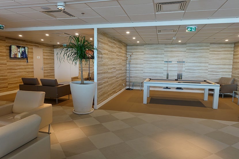 The lounge is quite spacious — it even includes a billiards area.