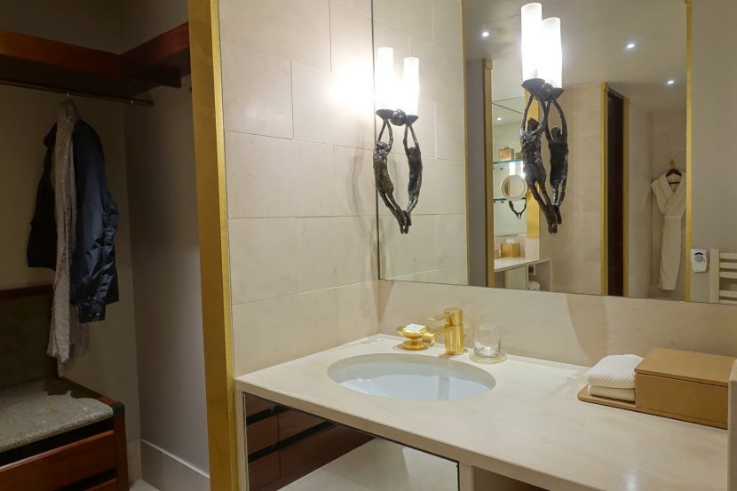 More storage space by one of the two sinks.